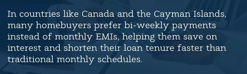 Homebuyer reviewing bi-weekly mortgage payment plan on laptop in bank office