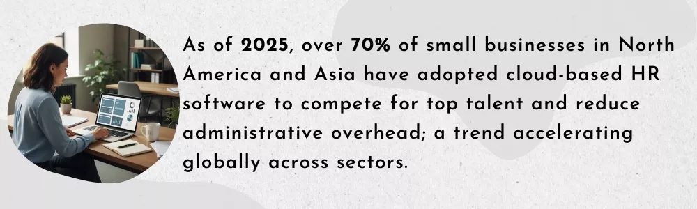 Small business owner using cloud HR software on laptop in office Small business owner using cloud HR software on laptop in office