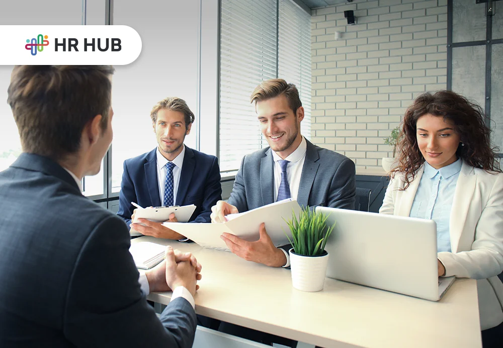 HR professionals using AI-driven tools to enhance modern talent acquisition